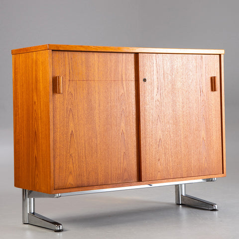 Teak sideboard on a chromed base.