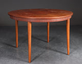 Danish round dining table with 1 leaf