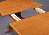 Teak dining table with extension by Forest City.