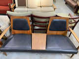 Made in North America wood and leather love seat