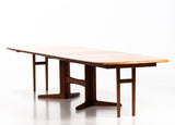 Solid rosewood Dining table/conference table with four additional plates. Korup chair factory.