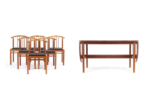 Solid Mahogany dining room table with two extension flaps and six matching chairs.