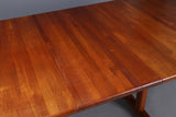 Impressive, Huge, solid teak pedestal based dining table with 2 self storing leaves