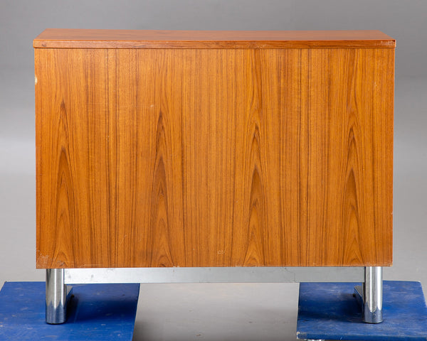 Teak sideboard on a chromed base.