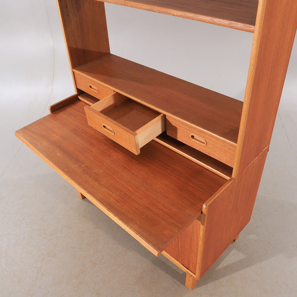 Teak cabinet with bookshelf  and drawers, with a pull out desk shelf. Ajfa, by Tibro. Sweden.