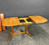 Solid Teak dining tables With 2 self storing leaves, by Dyrlund , Denmark