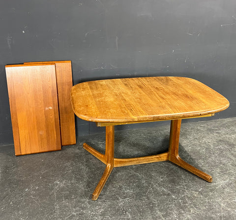 Solid Teak dining tables With 2 self storing leaves, by Dyrlund , Denmark