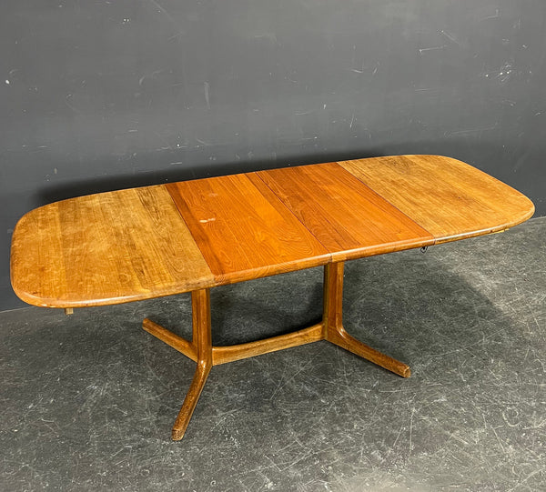 Solid Teak dining tables With 2 self storing leaves, by Dyrlund , Denmark