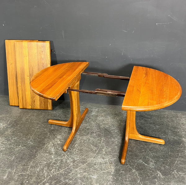 Large round Solid Teak Dining table with 2 extention inserts.