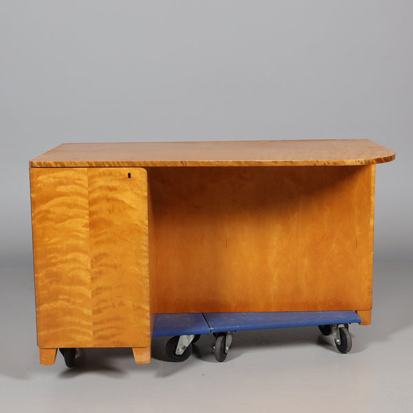 SOLID FLAMING BIRCH DESK, second half of the 20th century.