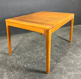 Solid teak table with two extension leaves. Produced by Niels Bach Denmark