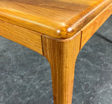 Solid teak table with two extension leaves. Produced by Niels Bach Denmark
