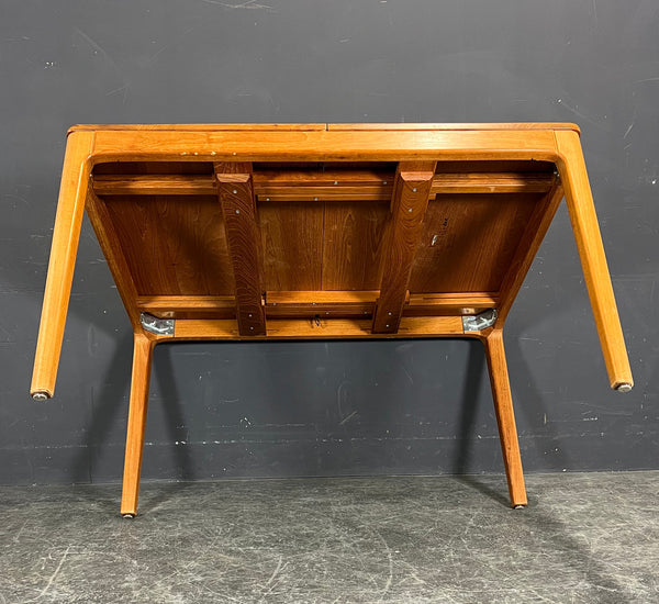 Solid teak table with two extension leaves. Produced by Niels Bach Denmark