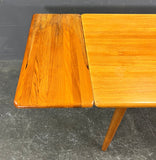 HIGHLY UNUSUAL RECTANGULAR SOLID TEAK EXTENDABLE DINING TABLE.