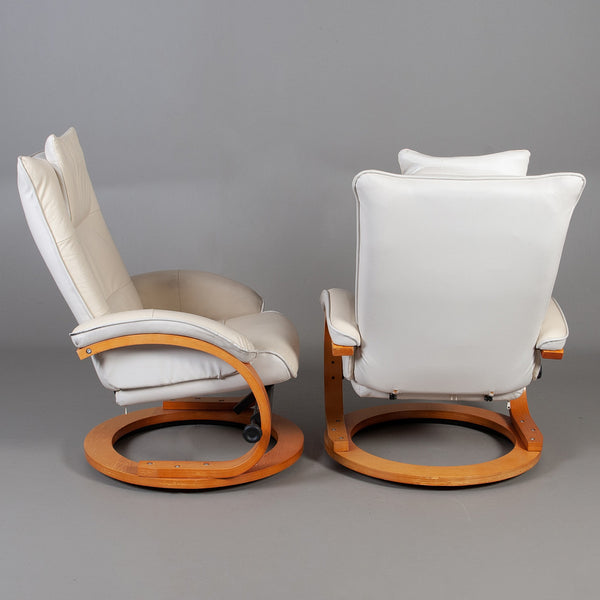 LEATHER ARMCHAIRS WITH FOOTSTOOL, a pair, comfort model.