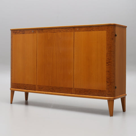 A Swedish Modern sideboard TEAK AND MAHOGANY COMBINATION , 1940s/50s.