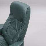 SPINNING ARMCHAIR WITH FOOTSTOOL, green leatherette, 1900/2000s.
