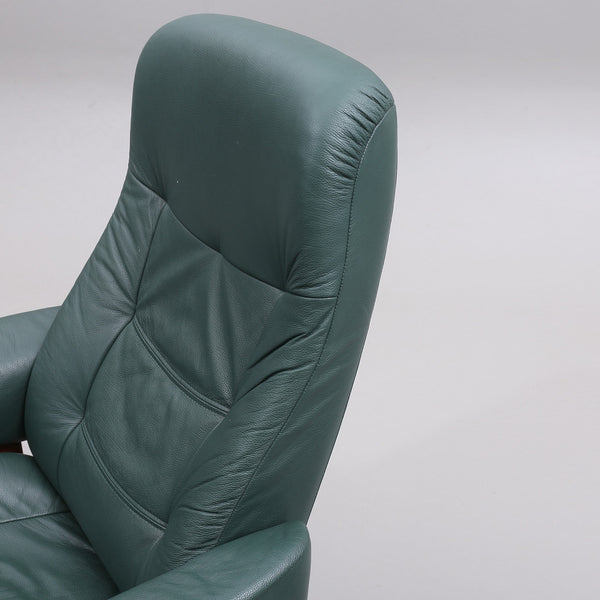 SPINNING ARMCHAIR WITH FOOTSTOOL, green leatherette, 1900/2000s.