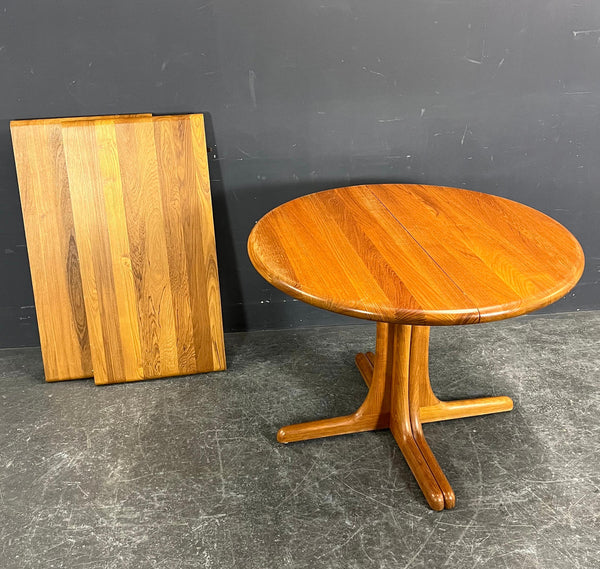 Large round Solid Teak Dining table with 2 extention inserts.