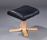 Anderssons. Easy chair with accompanying stool, black leather.
