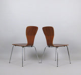 Backs of Teak Finish Plywood Stackable Chairs with Chromed Steel Legs by Tapio Wirkkala