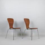 Angled View of Teak Finish Plywood Stackable Chairs by Tapio Wirkkala