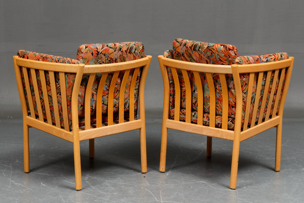 Pair of armchairs with beautifully curved beech frame.