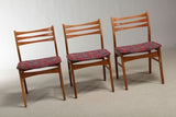Three Teak Dining Chairs with Red Patterned Seats