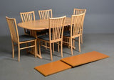 Beech Dining Chairs with Black Patterned Seats and Wood Backs Around a Beech Table