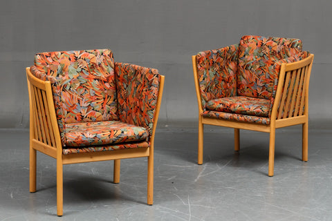 Pair of armchairs with beautifully curved beech frame.