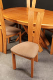 Sculptural Cherry Dining Set featuring and Table with two leaves and six Chairs