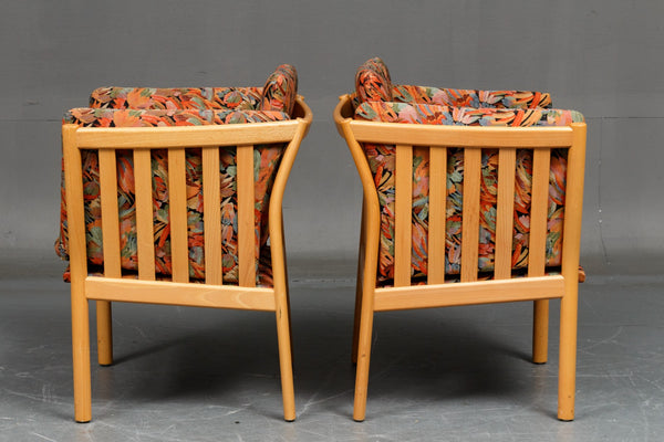 Pair of armchairs with beautifully curved beech frame.