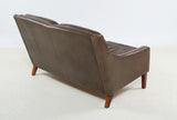 Poul M. Volther Love seat upholstered in brown leather.