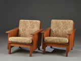 A pair of Danish armchairs with Solid teak frames, with removable cushions.