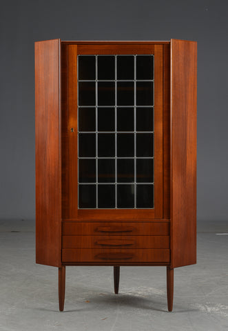 Corner cabinet with drawers.