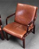 Danish furniture manufacturer. Pair of armchairs, leather. (2)*