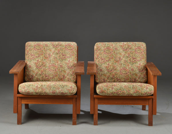 A pair of Danish armchairs with Solid teak frames, with removable cushions.