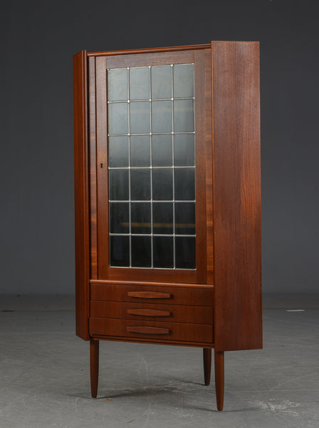 Corner cabinet with drawers.