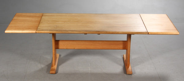 Dyrlund. Dining table with pair of extension leaves, Solid cherry wood.