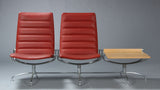 Jens Ammundsen for Fritz Hansen. SAS lounge set. Two red leather lounge chairs with connected side table.
