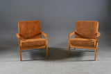 A pair of white European oak armchairs. Probably Erik Chambert