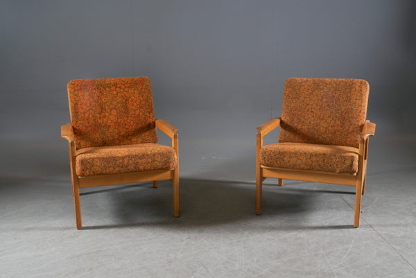 A pair of white European oak armchairs. Probably Erik Chambert