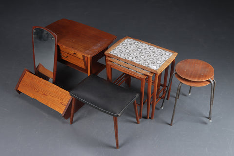 Set of teak stools with metal legs.