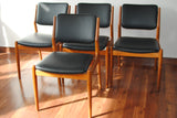 Four Black Leather Teak Frame Dining Chairs by Arne Vodder