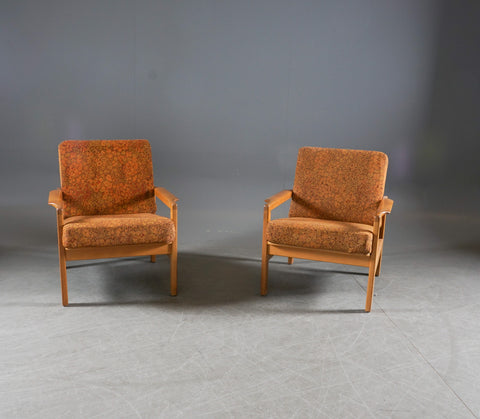 A pair of white European oak armchairs. Probably Erik Chambert