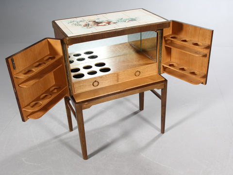Danish furniture manufacturer. Unique Freestanding bar cabinet, walnut, 1950s