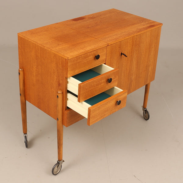 CABINETS on wheels, teak, 1960s.