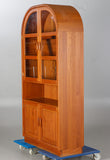 Teak cabinet with glass and wooden doors.