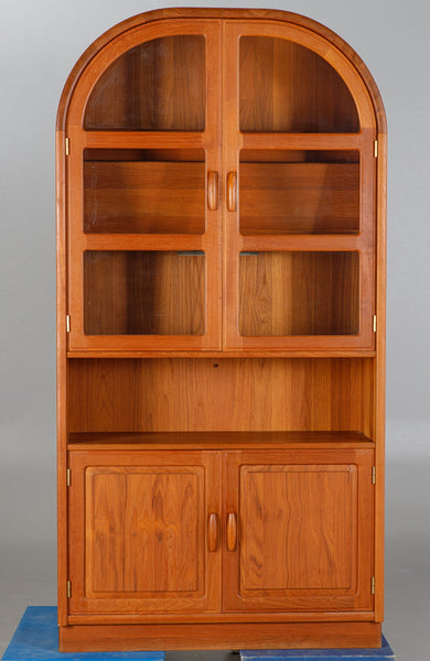 Teak cabinet with glass and wooden doors.