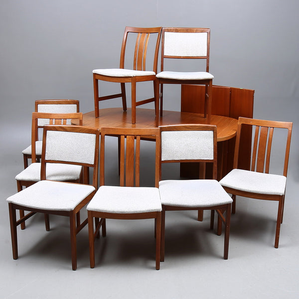 Teak DINING GROUP, 9 items + 2 extension leaves, 20th century.